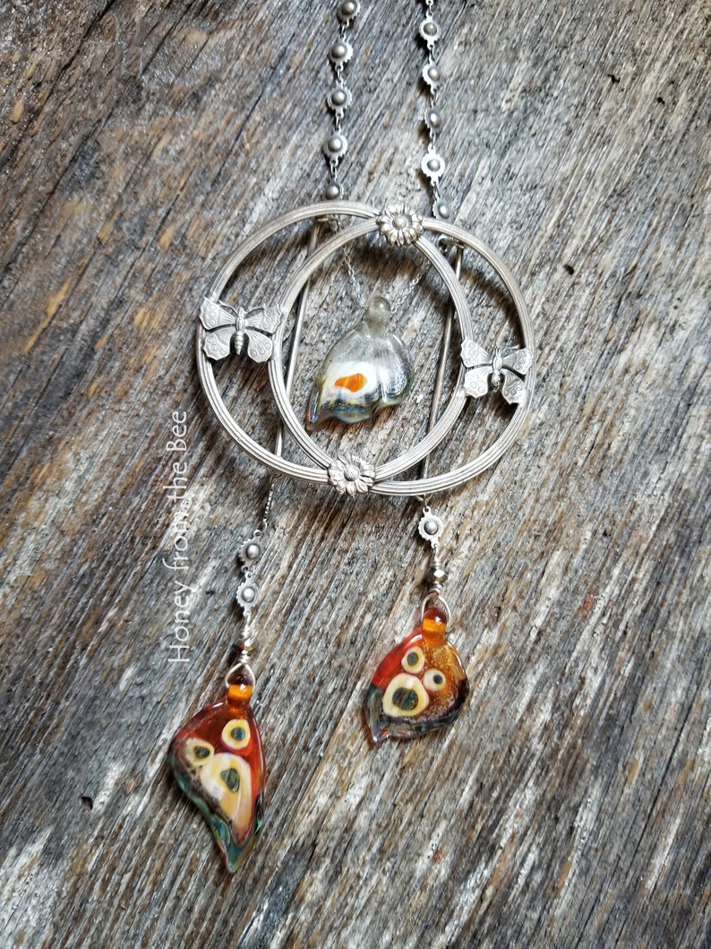 One of a kind butterfly necklace features antique buckle and lampwork butterfly wings.