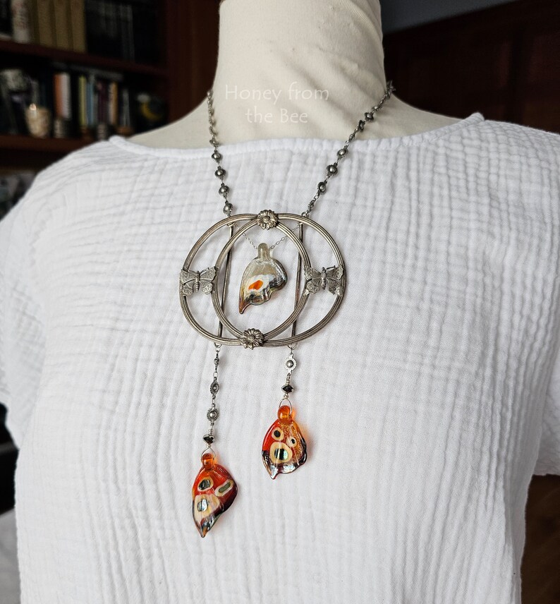Butterfly necklace on model.