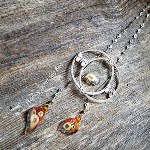 Repurposed antique buckle becomes focal with art glass butterfly wings in this statement necklace.