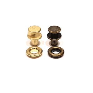 May include: Two sets of metal screw-back studs and matching washers. One set is finished in a bright gold tone, while the other set features a dark, antique bronze finish. Each stud has a flat circular top and a threaded post for secure attachment.
