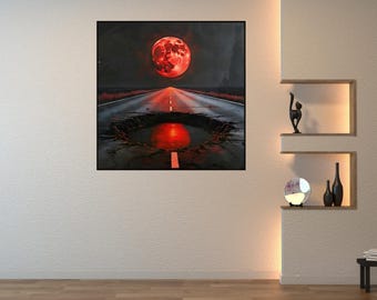 May include: A framed artwork depicts a surreal landscape with a large, red moon dominating a dark sky. A road leads towards the moon, reflecting its light in a pool of water. The artwork has a dramatic, otherworldly feel.