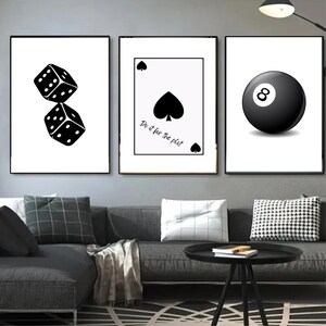 May include: Three black and white framed prints with a dice, a playing card, and a billiard ball. The playing card is the ace of spades and has the text "Do it for the plot".