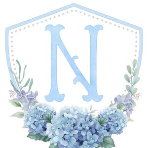 May include: A light blue watercolor monogram with the letter "N" in a shield shape. The shield is surrounded by a wreath of blue hydrangeas and green leaves.