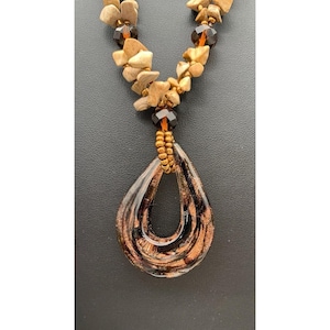 May include: A set of three ceramic mugs with a speckled, matte finish. The mugs are in shades of cream, light gray, and dark gray. Each mug has a simple, minimalist design and a rounded handle.