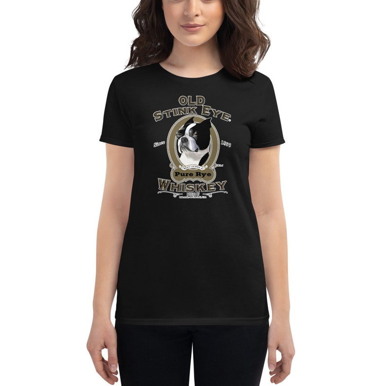 May include: Black t-shirt with a graphic of a Boston Terrier dog with the text "Old Stink Eye Pure Rye Whiskey" in a vintage style.