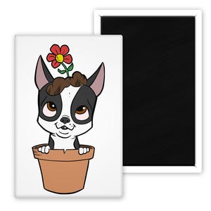 May include: A rectangular magnet featuring a cartoon dog with a flower growing from its head, sitting in a brown flower pot. The dog has black and white fur, brown eyes, and a smiling expression. The magnet has a white border and a black magnetic backing.