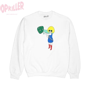 May include: White long-sleeved sweatshirt featuring a graphic of a cartoon character holding a megaphone. The character has yellow hair, blue eyes, and is wearing a blue dress, red boots, and sunglasses. The text "POPKILLER" is printed on the sweatshirt.