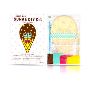 May include: A craft kit for making a sand art ice cream cone. The kit includes a wooden ice cream cone shape, coloured sand, a toothpick, and a twist tie. The instructions say "Peel off the stickers and sprinkle sand to make SUNAE!"