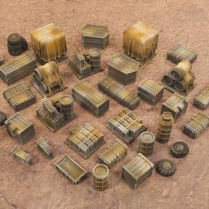 May include: A selection of miniature, weathered industrial terrain pieces in grey and brown. The set includes crates, barrels, and structures, suitable for tabletop gaming or model building.