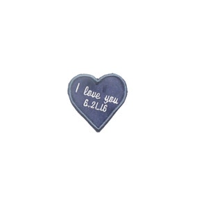May include: A blue felt heart-shaped patch with white embroidery that reads "I love you 6.2.16".