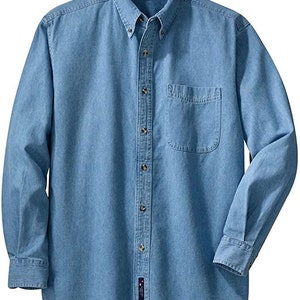 May include: Light blue denim shirt with long sleeves, a button-down front, and a single chest pocket. The shirt has a classic collar and buttoned cuffs. The fabric appears to be a medium-weight denim.