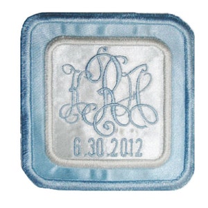 May include: A light blue square patch with a white inner square. The inner square has a monogram with the letters "C.B.H." in a script font. The date "6.30.2012" is printed below the monogram.
