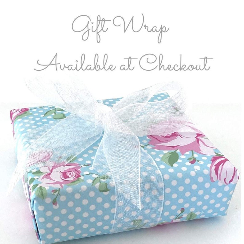 a gift wrap is wrapped in blue and white polka dots