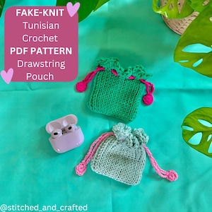 May include: Two crocheted drawstring pouches, one green and one light green, with pink accents. The pouches are on a turquoise surface with a white case for wireless earbuds. The text "FAKE-KNIT Tunisian Crochet PDF PATTERN Drawstring Pouch" is in a pink box at the top of the image.