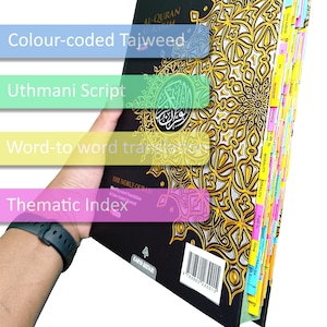 May include: A black Quran with gold accents and color-coded tabs. The cover features the text "AL-QURAN" and "The Noble Quran" with a word-to-word translation and color-coded Tajweed. The book also includes a thematic index.