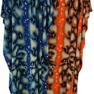 May include: Two flowing, loose-fitting caftans. One is a vibrant blue with a white and black pattern, and the other is a bold orange with a similar design. The fabric appears lightweight, suitable for warm weather.