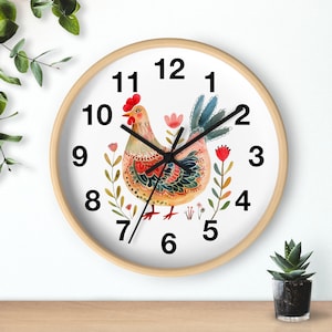 May include: A white clock with black numbers and hands, featuring a colorful rooster illustration with floral accents. The clock has a wooden frame.