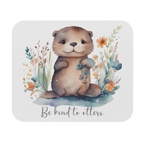 May include: A watercolor illustration of a cute otter surrounded by flowers. The otter is brown and has a white chest. The flowers are in shades of blue, yellow, and orange. The text "Be kind to otters." is written below the otter.