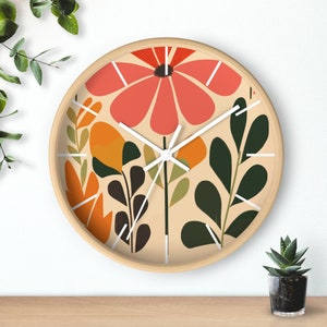 May include: A round wall clock with a beige background and a floral design. The clock features a large red flower with orange and green leaves. The clock hands are white.