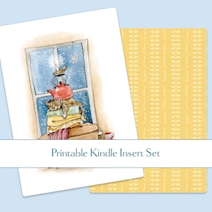 May include: Printable Kindle insert set featuring a watercolor illustration of a cat sleeping on a stack of blankets by a snowy window. A red teapot sits atop the blankets. The text "Printable Kindle Insert Set" is displayed.