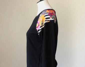 cotton jersey raglan long sleeved top/scoop crew neckline/black with striped floral