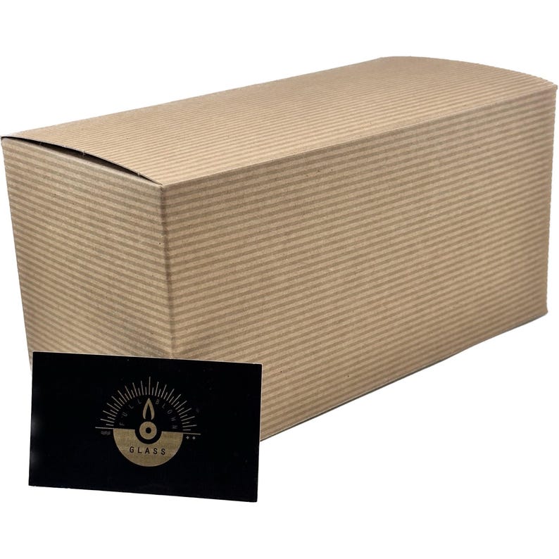 A cardboard box and a business card are shown in the image.