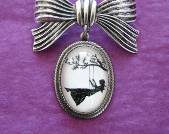 GIRL on a SWING Brooch - pendant on bow pin - Silhouette Jewelry