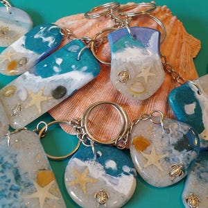 Keychain Handmade High Quality Epoxy Resin with silver Sea Turtle, tiny Starfish and Seashells Ocean Beach Sea Creatures animals.Very Unique