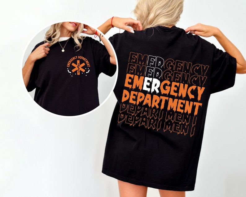 Two black t-shirts. One features an orange medical cross emblem with the text 'Emergency Department'. The other has the words 'Emergency Department' repeated in a stacked, distorted orange and white print on the back.