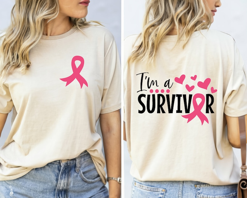 A beige shirt with a pink ribbon on the left side and the text 'I'm a SURVIVOR' with a pink ribbon on the right side.