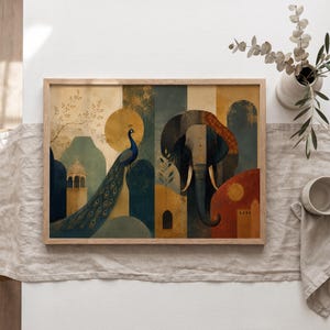 May include: A rectangular framed wall art print featuring a stylized illustration of a peacock and an elephant. The artwork uses a palette of deep blue, mustard yellow, and terracotta red, depicting architectural elements and circular sun motifs.