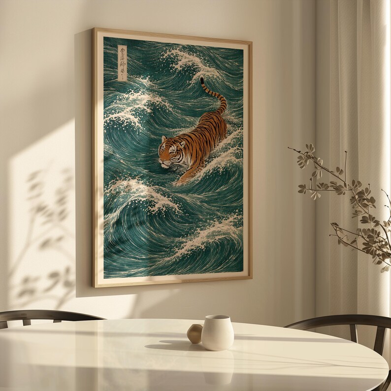 May include: Framed art print featuring a tiger swimming through teal waves. The tiger has orange and black stripes and is set against a backdrop of white-capped waves. The artwork is in a wooden frame.