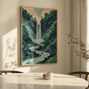 May include: A framed art print depicting a waterfall cascading down a lush, green mountain landscape. The artwork features shades of blue, green, and white, with a light pink sky. The print is in a natural wood frame.