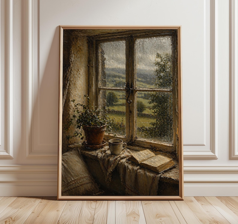 May include: A framed painting depicts a rainy day view through a window. A potted plant, a mug, and an open book rest on the windowsill. The window frames a green landscape with rolling hills and trees. The artwork is in warm, earthy tones.