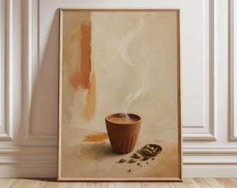 May include: A framed art print featuring a terracotta cup of steaming tea, with a small bowl of spices and scattered seeds. The background has abstract orange and beige brushstrokes. The artwork is set against a neutral backdrop.