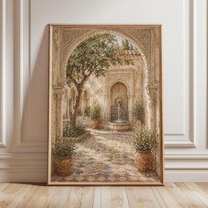 May include: Framed watercolour painting of an ornate courtyard with a fountain, arched doorways, and potted plants. The artwork features a tree, intricate architectural details, and a warm colour palette of beige, brown, and green.