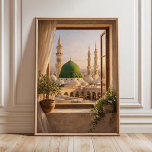 May include: A framed print of a scenic view through a window. The image showcases a mosque with a large green dome and multiple minarets. The window frame is wooden, and the scene is framed by a beige curtain and potted plants.