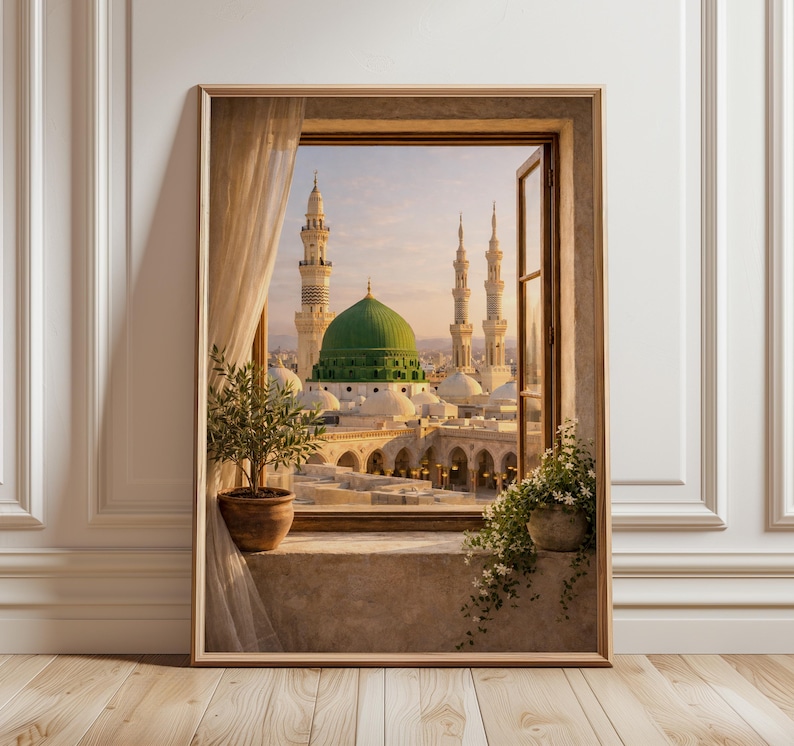 May include: A framed print of a scenic view through a window. The image showcases a mosque with a large green dome and multiple minarets. The window frame is wooden, and the scene is framed by a beige curtain and potted plants.