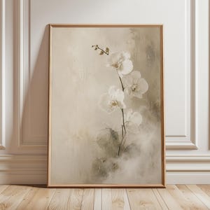 Minimal white orchid fine art print with soft cream background, misty spa atmosphere, neutral beige tones, and elegant botanical flowers.