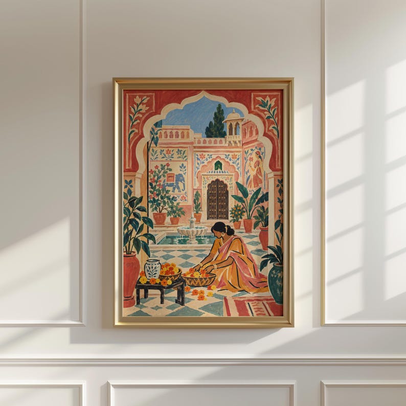 May include: A framed wall art print depicting a courtyard scene with a person in a yellow garment arranging orange flowers in baskets. The setting features a stone fountain, potted plants, and architectural arches in shades of red and blue.