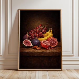 May include: A framed still life painting of various fruits. The composition includes bananas, red grapes, figs, and pomegranates. The artwork is set against a dark background, with a wooden table. The painting is in a gold frame.