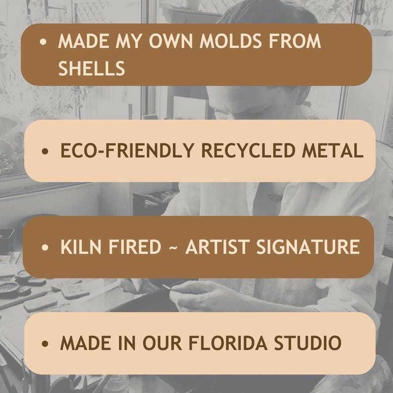 May include: Image with text: "MADE MY OWN MOLDS FROM SHELLS", "ECO-FRIENDLY RECYCLED METAL", "KILN FIRED ~ ARTIST SIGNATURE", and "MADE IN OUR FLORIDA STUDIO". The image shows a person working in a studio.