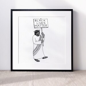 May include: Black and white illustration of a person wearing a crown of thorns and a face mask with the letters "BLM" on it. The person is holding a sign that reads "Black Lives Matter".