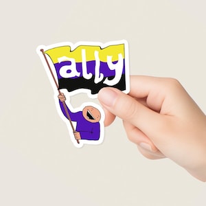 May include: A sticker depicting a cartoon person holding a flag with the word "ally". The flag has yellow, purple, and black stripes. The figure is dressed in purple and has a smiling face.
