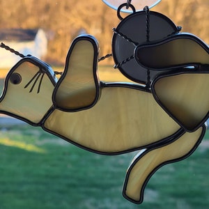 Stained Glass Cat playing with a white ball of yarn Suncatcher