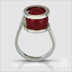 Sterling Ring with Carnelian hold by Two Rings