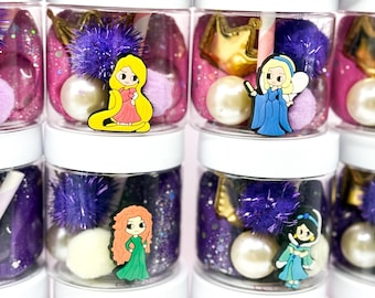 May include: A collection of clear plastic jars with white lids, each filled with colorful slime, glitter, and various character-themed charms. The jars contain purple and pink slime, white pearl-like beads, and fuzzy pom-poms, topped with cartoon figures.