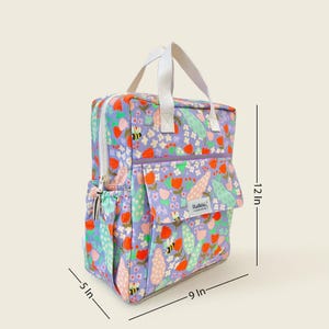 Kids floral backpack with dimensions 12x9x5 inches - compact yet roomy bag ideal for preschool or day trips.