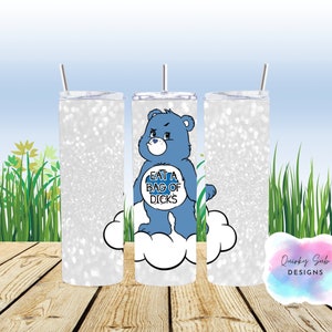 May include: A white glitter tumbler with a blue Care Bear character holding a sign that says "Eat a Bag of Dicks". The Care Bear is standing on a white cloud.