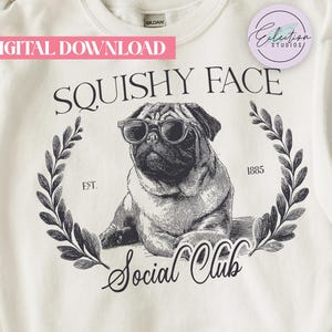 May include: White sweatshirt with a black and white illustration of a pug wearing sunglasses, surrounded by a laurel wreath. The text reads "SQUISHY FACE Social Club" with "EST. 1885". A pink banner says "DIGITAL DOWNLOAD".